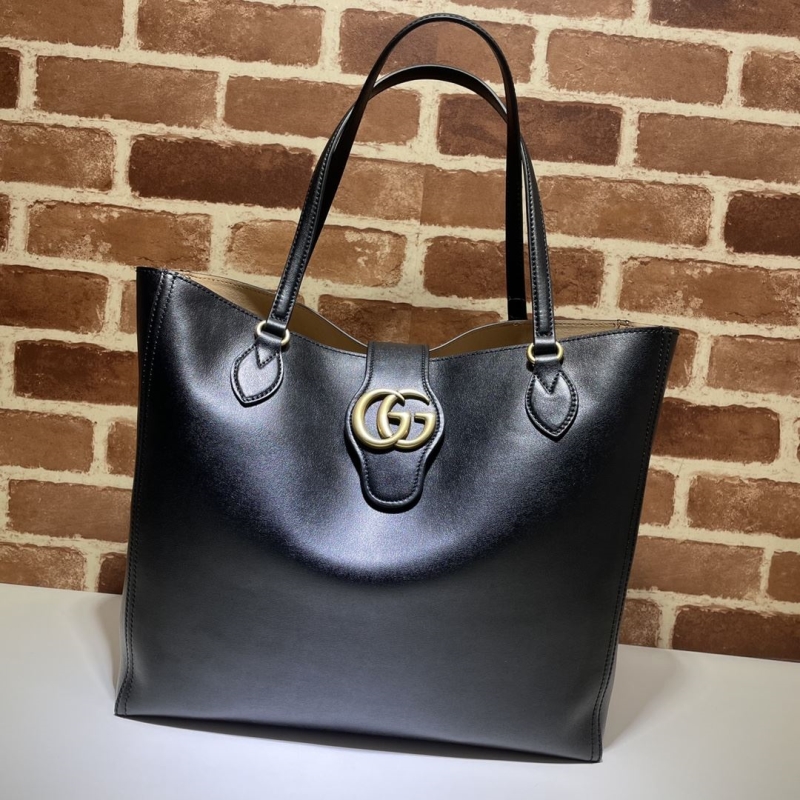 G*u*i shopping bags